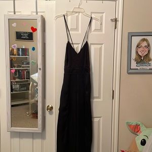 Black dress with a double slit in the legs.